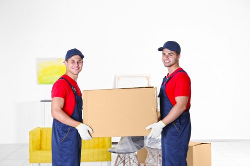 Professional movers handling office equipment in Greenwich