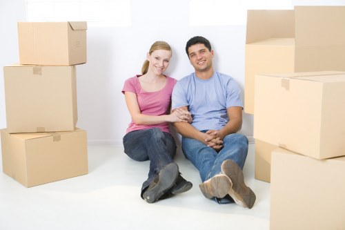 Local movers preparing a Greenwich home move with boxes and furniture
