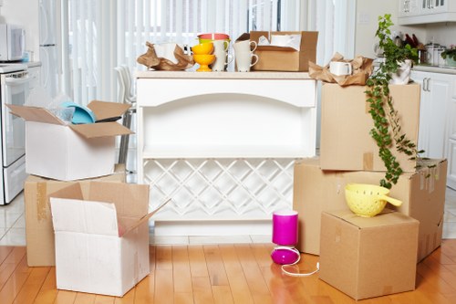 Mover wearing PPE while lifting furniture carefully