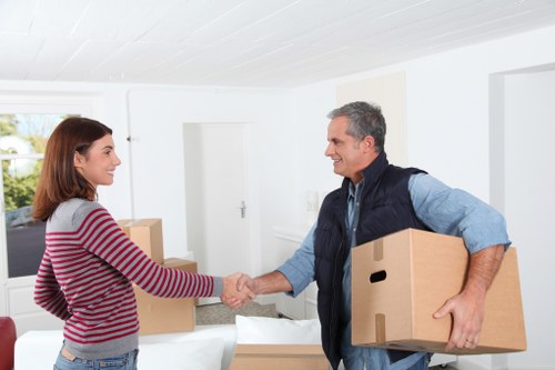 Sustainable moving team handling sorted items for reuse and recycling